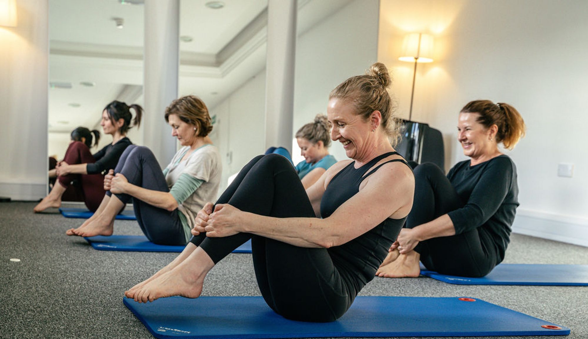 A small Pilates mat class enjoying a movement sequence at York Pilates Space